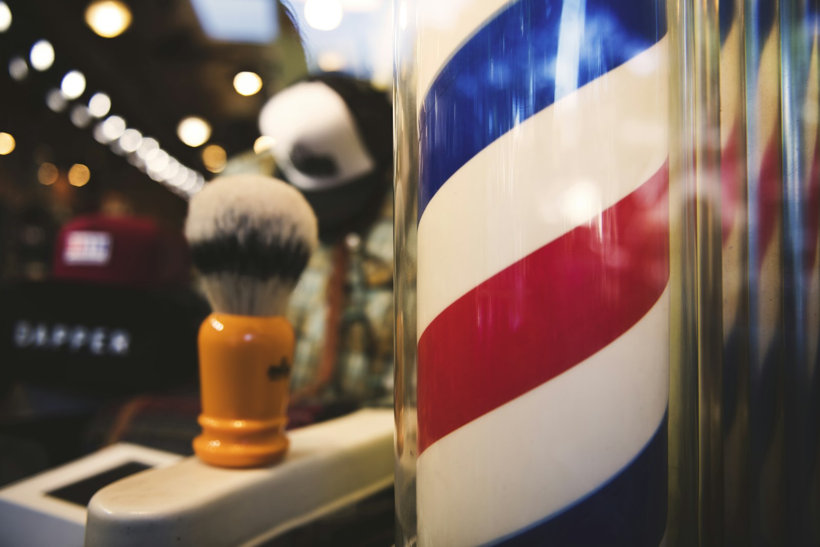 Barber consulting a client at Fadehouse Barber Co