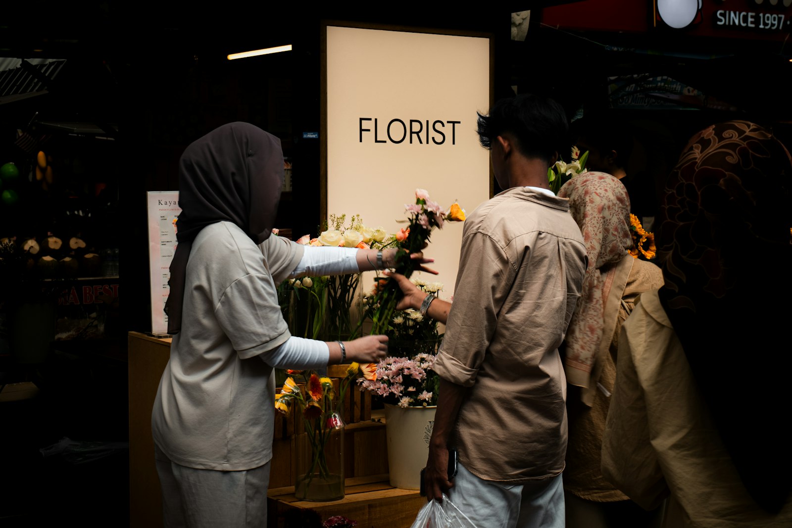 A hand-tied seasonal bouquet resting on a worktable